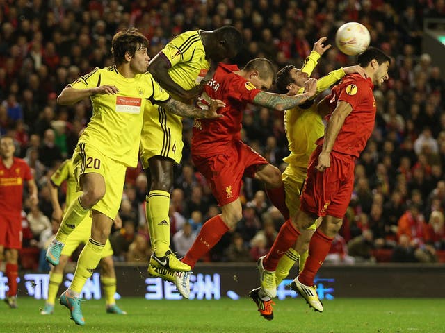 Daniel Agger and Luis Suarez, of Liverpool, put pressure on Anzhi last night