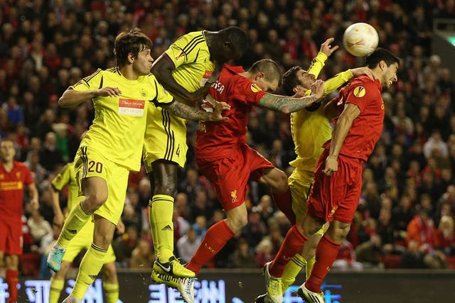 Daniel Agger and Luis Suarez, of Liverpool, put pressure on Anzhi last night