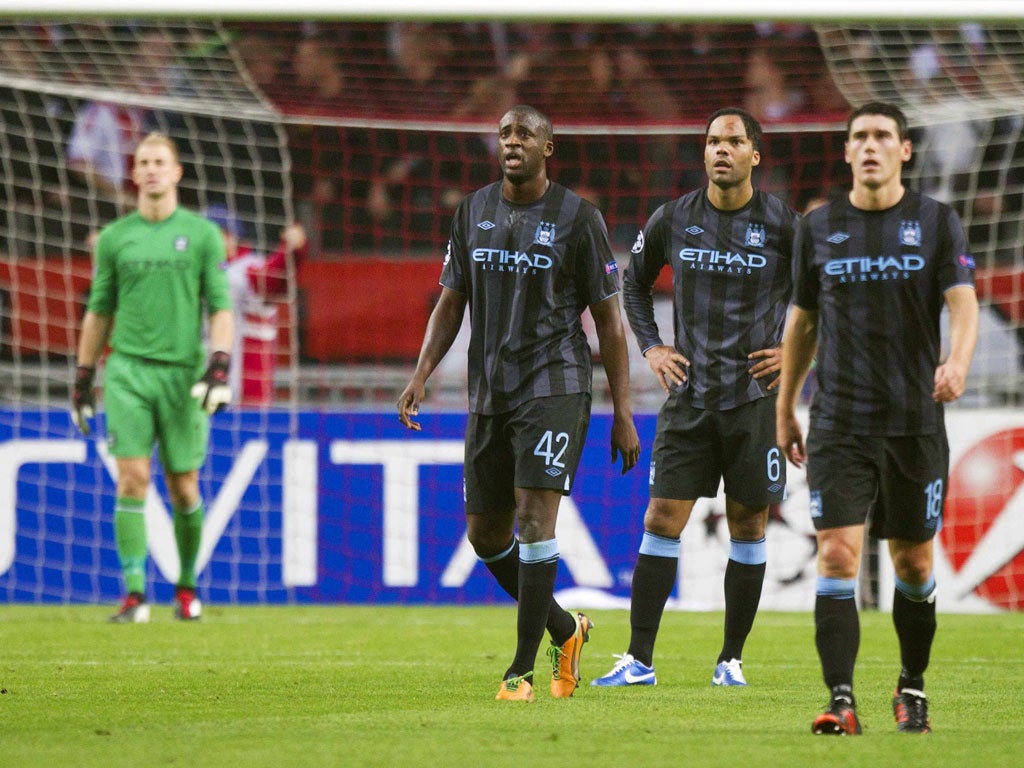 Dejected City players regroup on Wednesday night