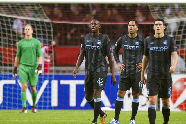 Dejected City players regroup on Wednesday night