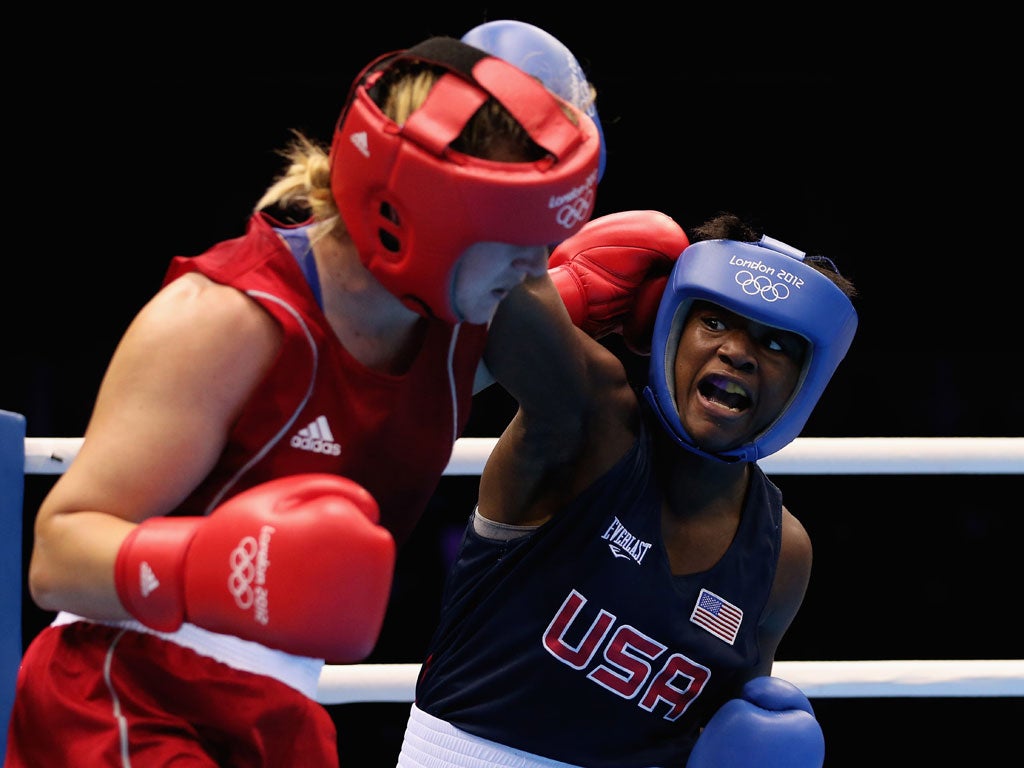 Marina Volnova of Kazakhstan and America's Claressa Shields compete in the Olympics