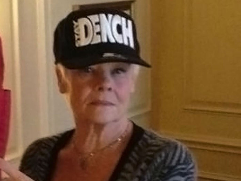 Judi Dench cemented her place in the lady dude hall of fame later in the week by getting a picture of herself on Twitter wearing a Dench cap