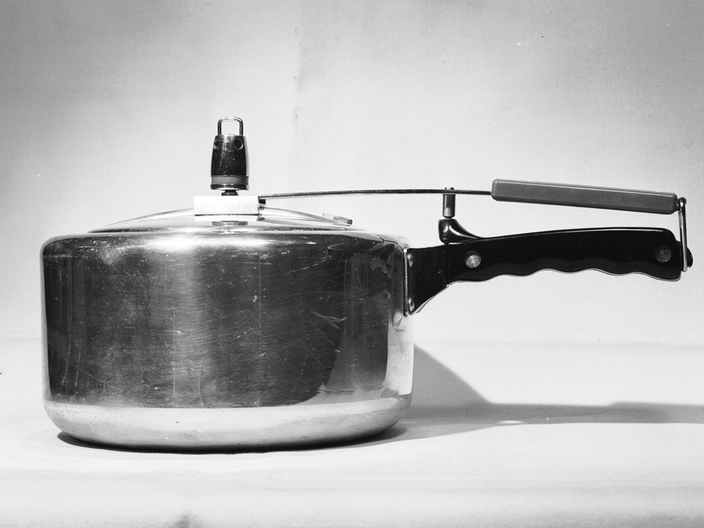 A saucepan or pressure cooker with a lid.