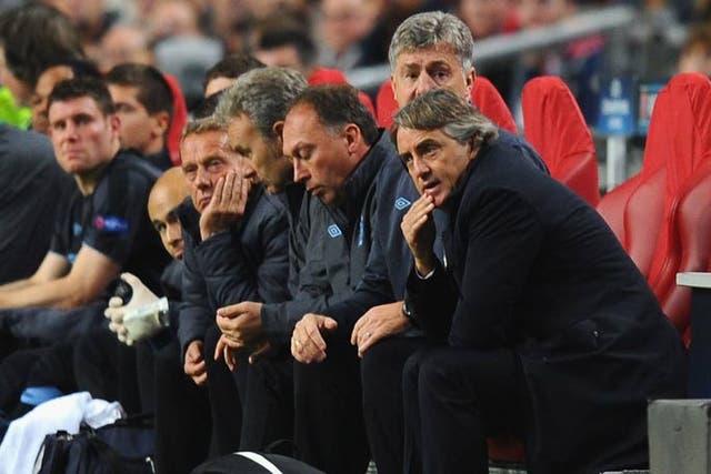 Mancini looks on during the defeat to Ajax
