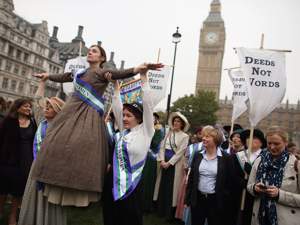 Campaigners dressed as suffragettes attend a rally organised by UK Feminista to call for equal rights for men and women on October 24, 2012 in London, England.