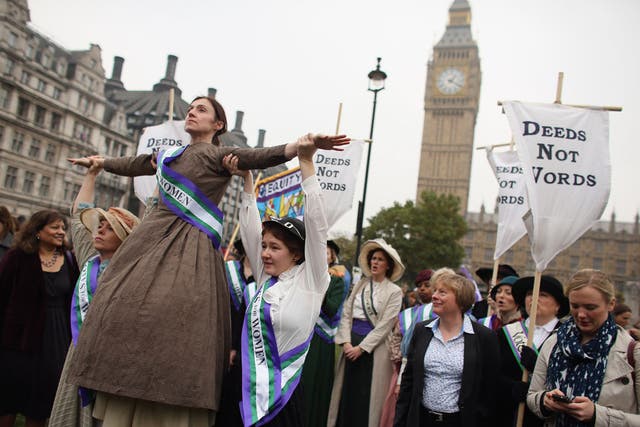 Campaigners dressed as suffragettes attend a rally organised by UK Feminista to call for equal rights for men and women on October 24, 2012 in London, England.