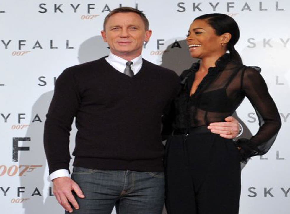 Daniel Craig and Naomie Harris pose during the photocall for Skyfall