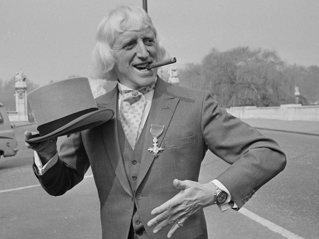 Hidden scandal: Jimmy Savile, when he was made OBE in 1972