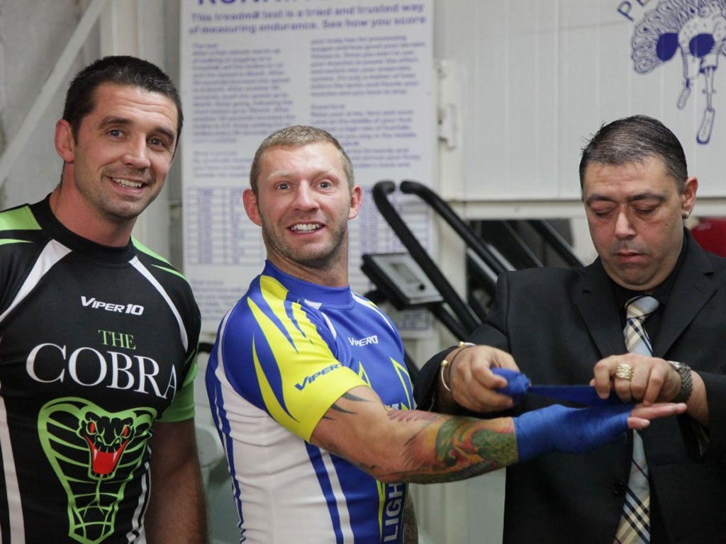 Fighting spirit: Alan Quinlan (left) and Sean Long (centre) prepare for a sparring session at the Peacock Gym in east London