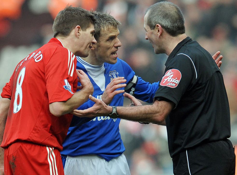 Mersey heat: Phil Neville and Steven Gerrard (left) make their point in a typically highly charged derby