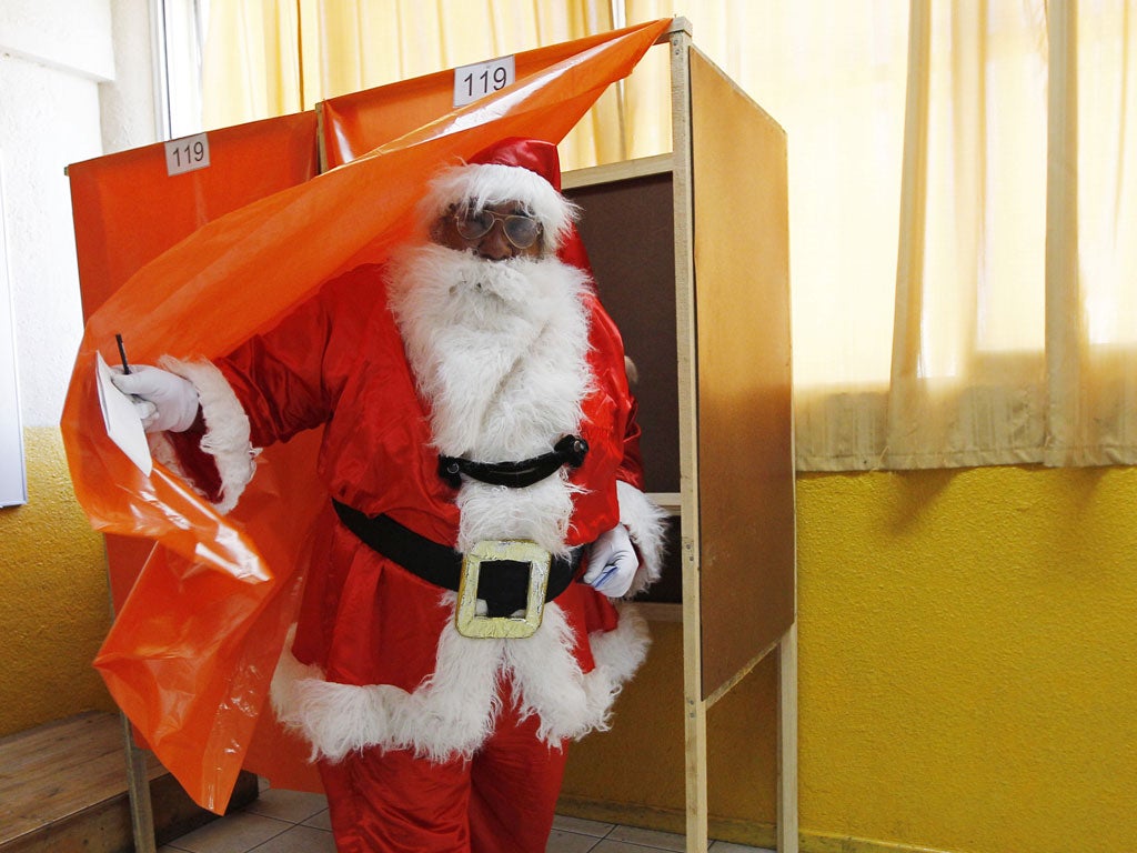 October 28, 2012: Rigoberto Martinez, 63, dressed as Santa Claus, casts his vote during municipal elections in Valparaiso city, about 121 km (75 miles) northwest of Santiago. Martinez said he has dressed as Santa Claus in all elections since Chile's return to democracy in 1990 from the 17-year dictatorship of Augusto Pinochet. Chilean voters will elect mayors and councilmen across 15 political regions on Sunday.