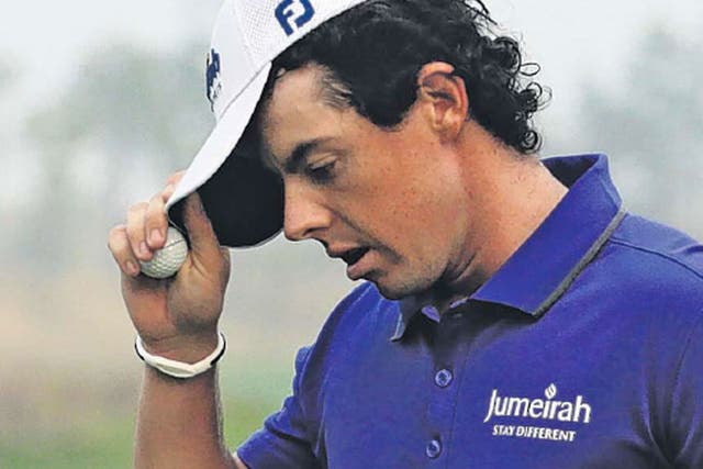 Rory McIlroy reacts after missing a birdie putt on the 18th green in Shanghai