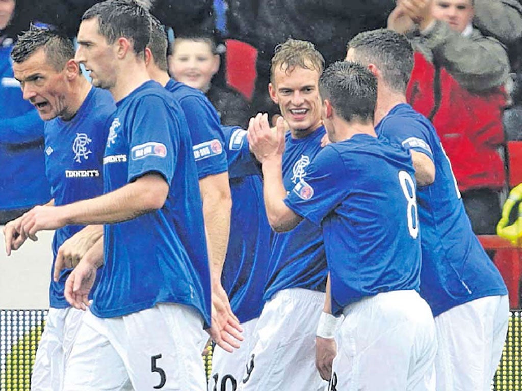 Dean Shiels celebrates scoring the opening goal in Rangers’ first win on the road