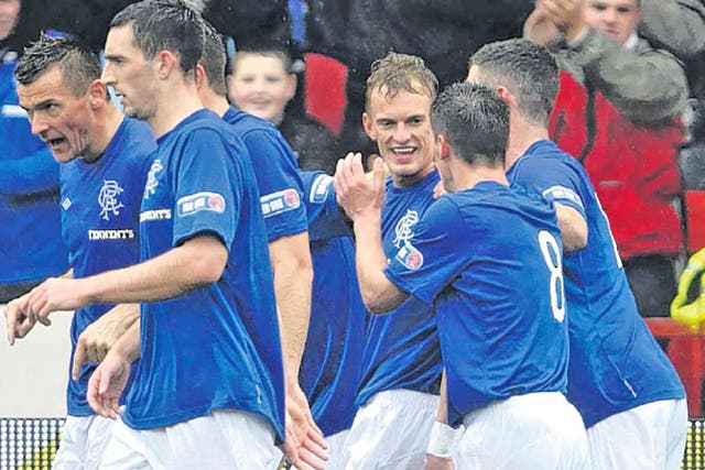 Dean Shiels celebrates scoring the opening goal in Rangers’ first win on the road