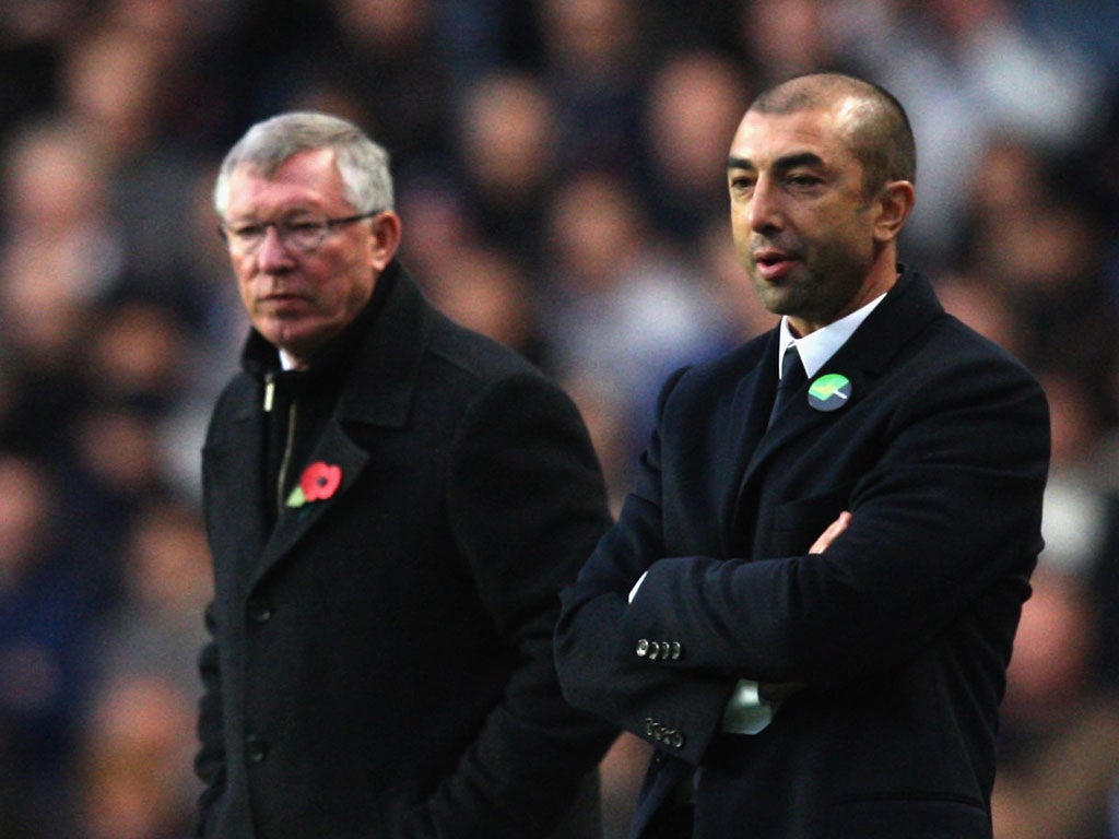 Managers Sir Alex Ferguson of Manchester United and Roberto di Matteo of Chelsea watch from the touchline