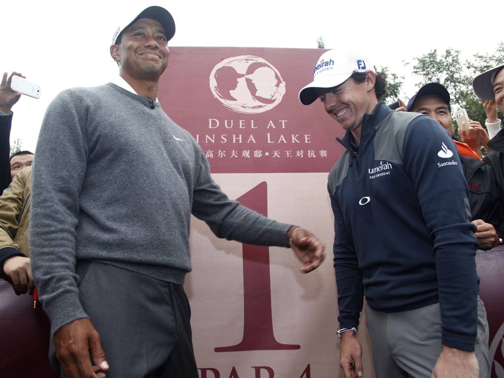 Rory McIlroy with Tiger Woods in China
