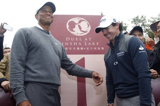 Rory McIlroy with Tiger Woods in China