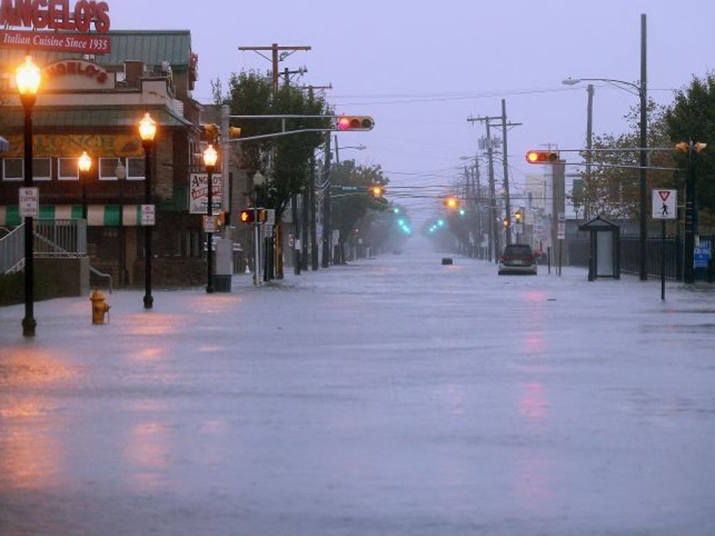 Water floods a street ahead of Hurricane Sandy in Atlantic City, New Jersey