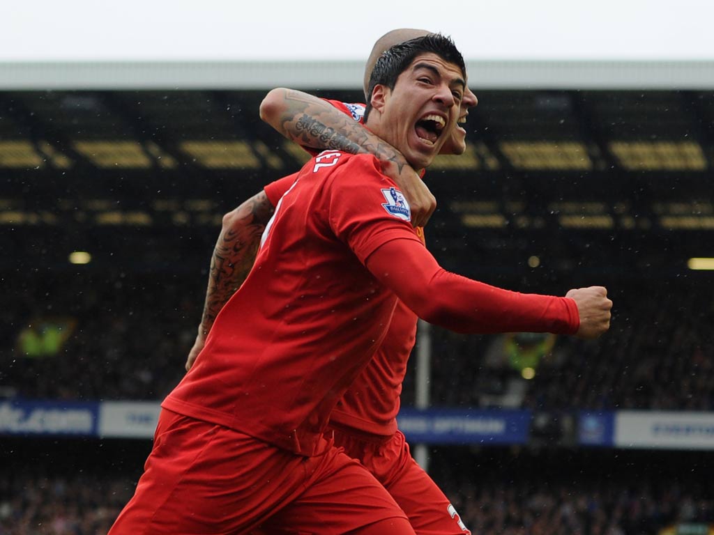 Liverpool striker Luis Suarez celebrates his goal against Everton