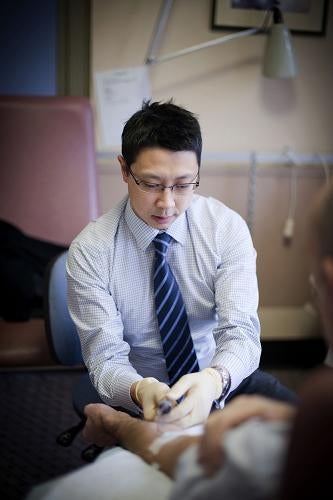 DIET CELIAC: “This approach has really revolutionized the way we treat a common condition,” says gastroenterologist Jason Tye-Din, shown collecting blood from a patient at the Walter and Eliza Hall Institute of Medical Research in Melbourne, Australia.