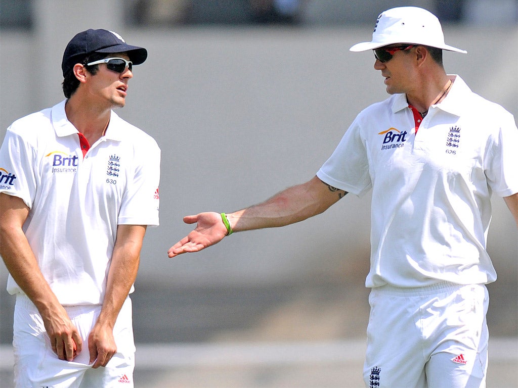 England captain Alastair Cook in discussion with Kevin Pietersen