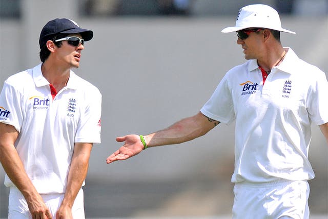 England captain Alastair Cook in discussion with Kevin Pietersen