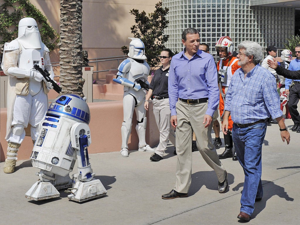 Walt Disney president and CEO Bob Iger with George Lucas, right, in Disney's Hollywood Studios theme park