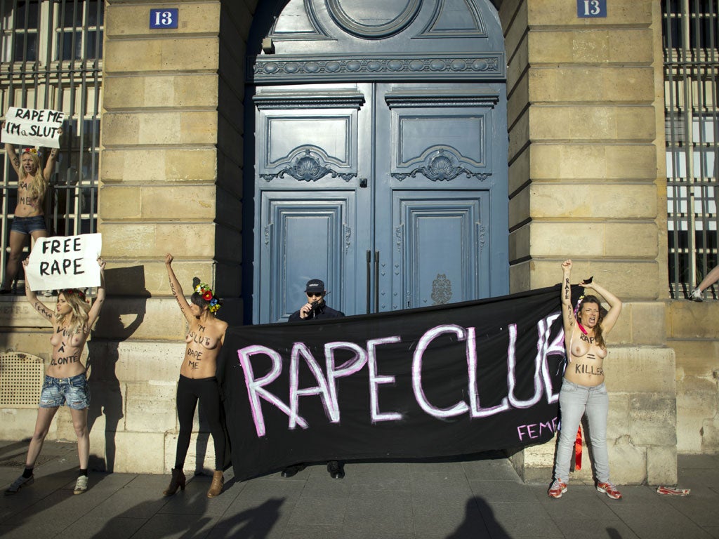 Topless activists of the Ukrainian women movement Femen demonstrate on October 15, 2012 in front of the Justice ministry in Paris, to protest against the verdict in a rape case.