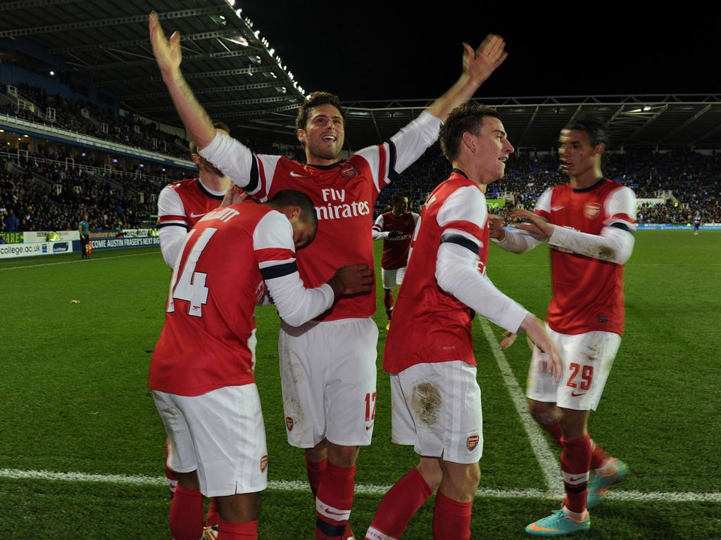 Theo Walcott celebrates scoring the sixth Arsenal goal