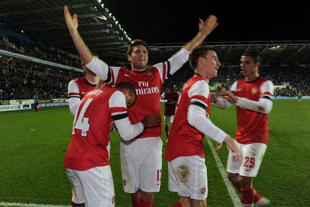 Theo Walcott celebrates scoring the sixth Arsenal goal 