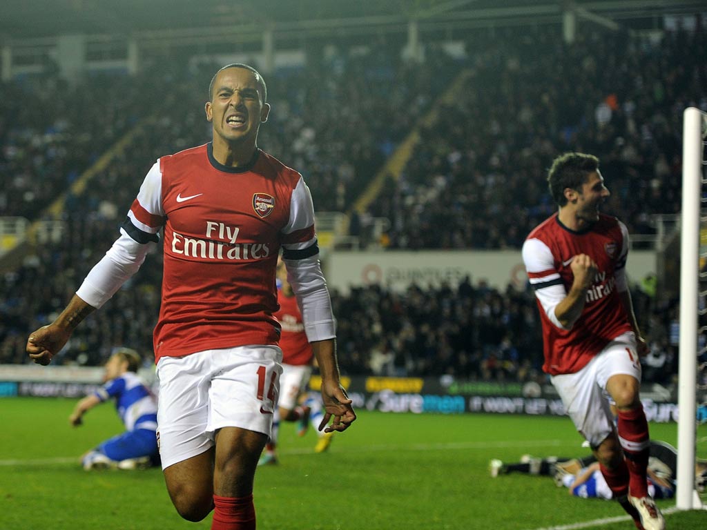 Theo Walcott celebrates the sixth goal for Arsenal