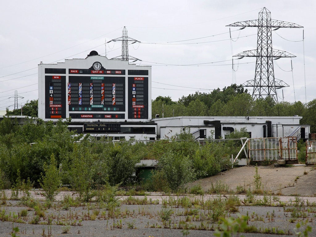 Weeds grow on the grounds of the Walthamstow greyhound dog racing stadium, which was closed in 2008