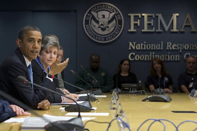 President Barack Obama, accompanied by Homeland Security Secretary Janet Napolitano, second from left, speaks about superstorm Sandy during a visit to the Federal Emergency Management Agency HQ in Washington