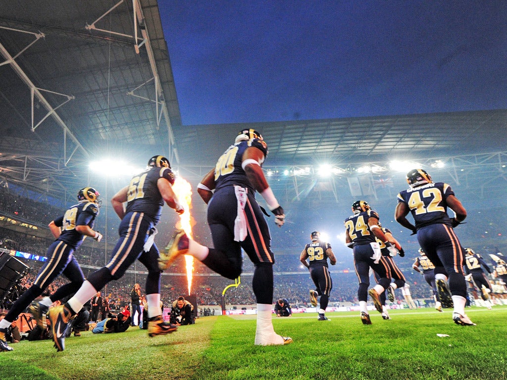 The St Louis Rams players make their entrance at Wembley on Sunday