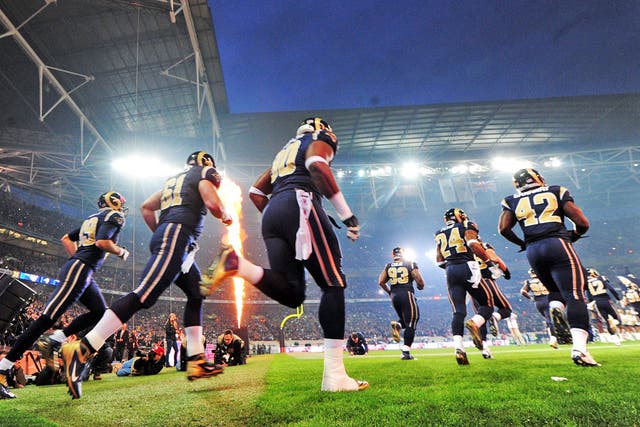 The St Louis Rams players make their entrance at Wembley on Sunday