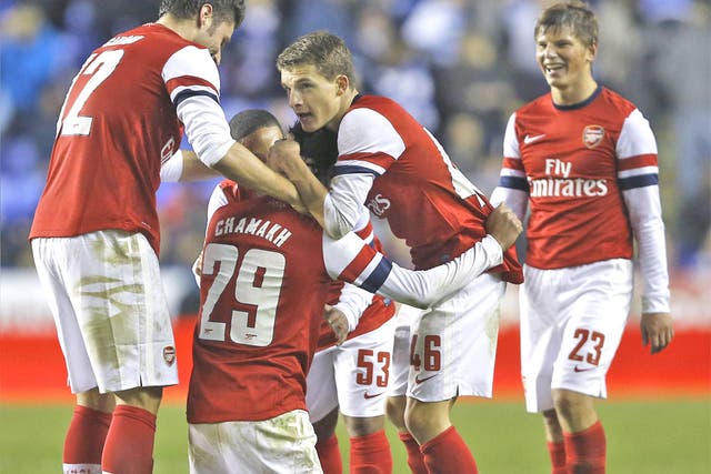 Arsenal celebrate their seventh goal on Tuesday