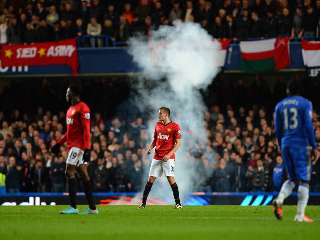 A flare was thrown onto the pitch during the Capital One Cup tie