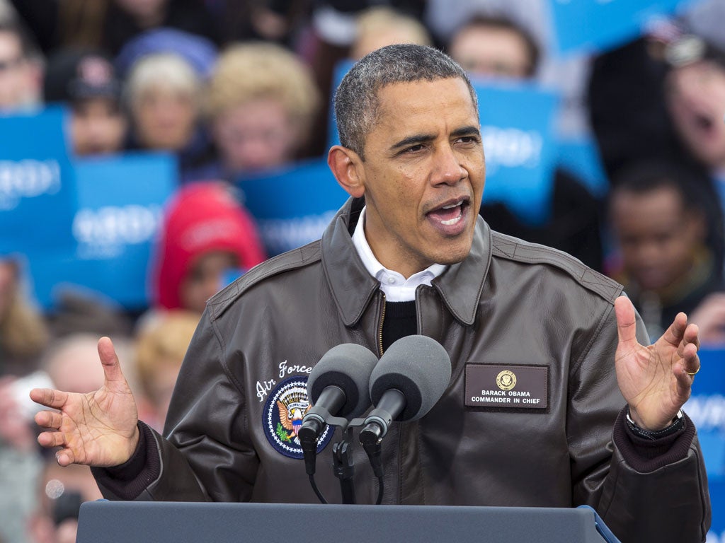 Barack Obama speaks at a rally in Green Bay, Wisconsin, yesterday before heading to Las Vegas