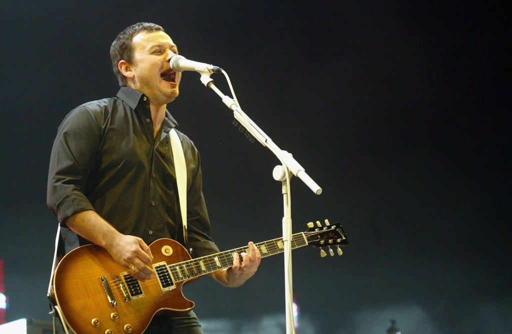 James Dean Bradfield of The Manic Street Preachers performs on stage at the 'Tsunami Disaster Fundraising Concert' at the Millennium Stadium on January 22, 2005 in Cardiff, Wales.The concert aims to raise funds for those affected by the Asian earthquake