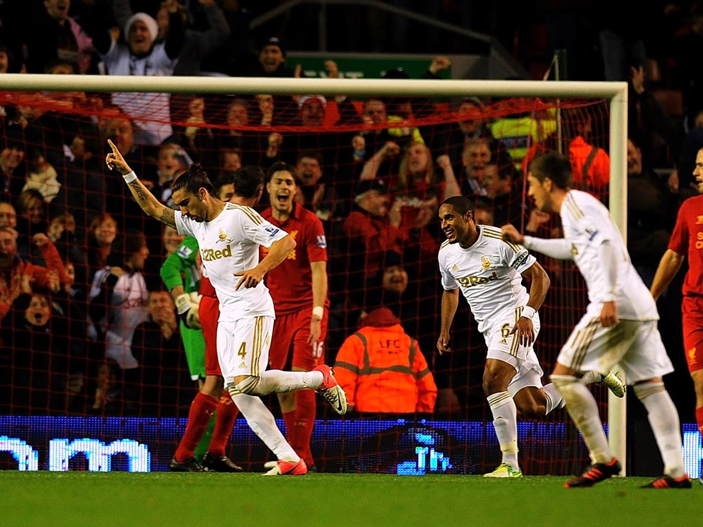 Chico Flores celebrates a goal against Liverpool