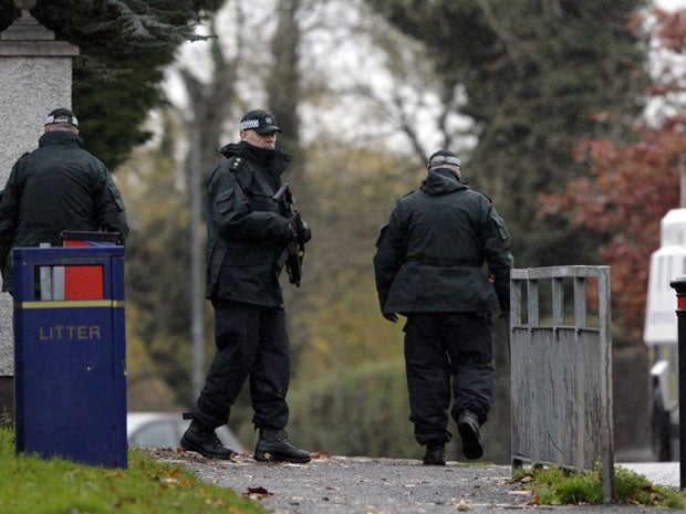 Police Service of Northern Ireland officers patrol the area close to the fatal shooting on the M1 motorway near Lurgan
