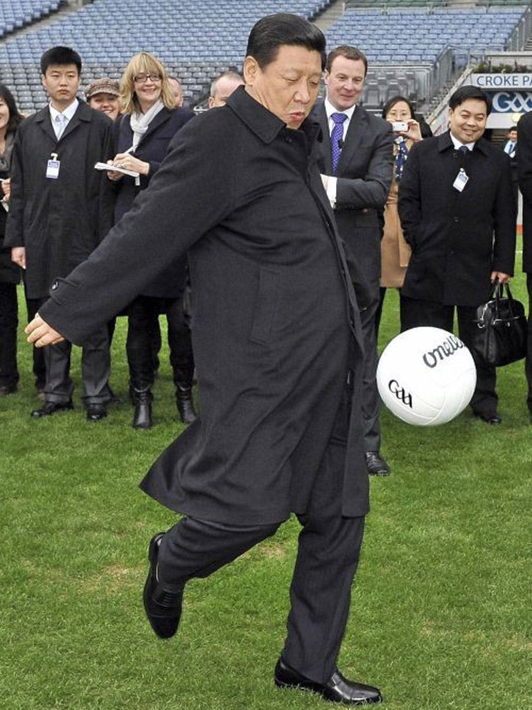 Xi Jinping kicks a football during visit to Croke Park Stadium in Dublin earlier this year