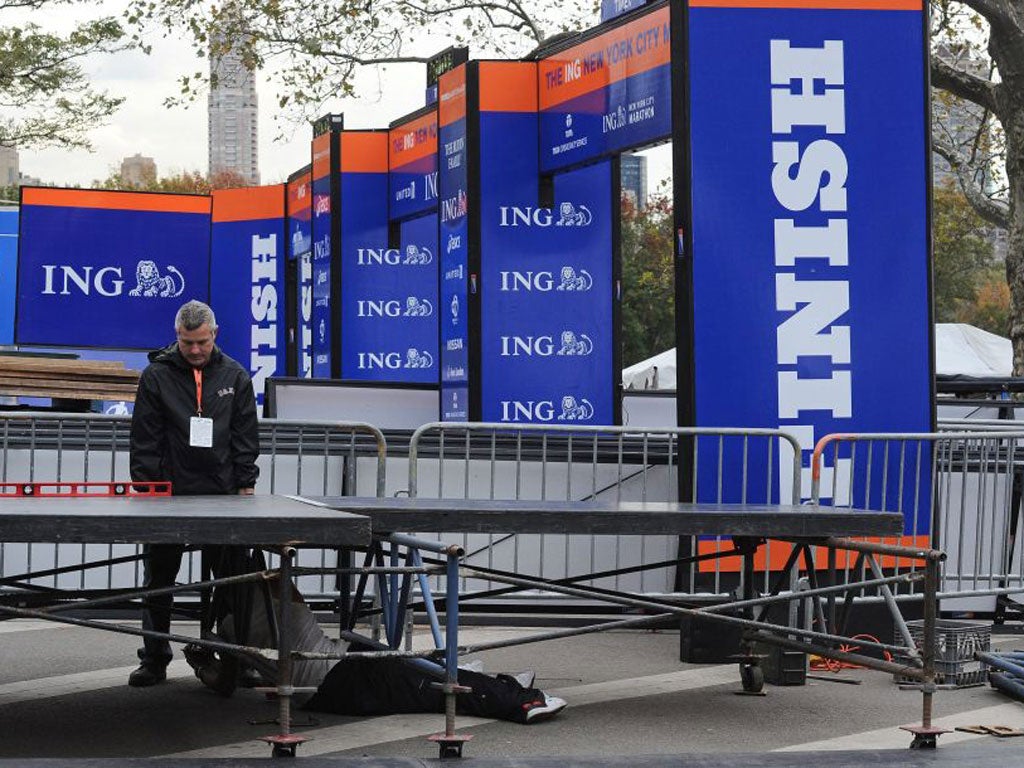 Workers near the Finish line of the cancelled New York City Marathon