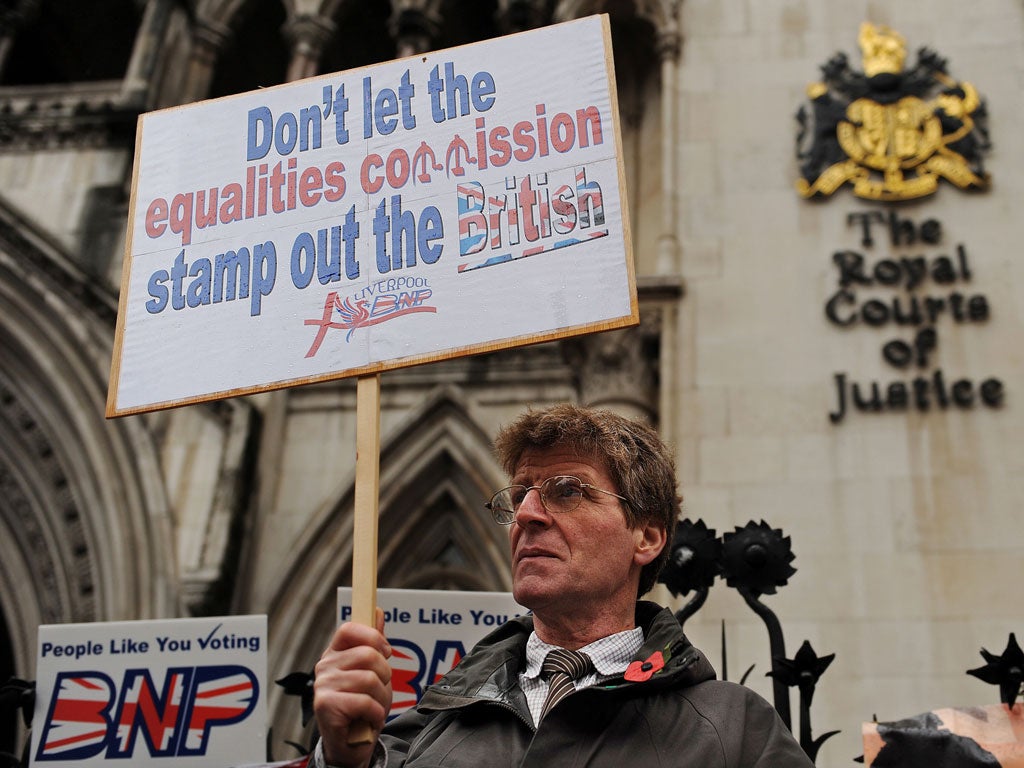 BNP supporters gather outside the High Court in central London on November 8, 2010 to protest against the Equality and Human Rights Commission.
