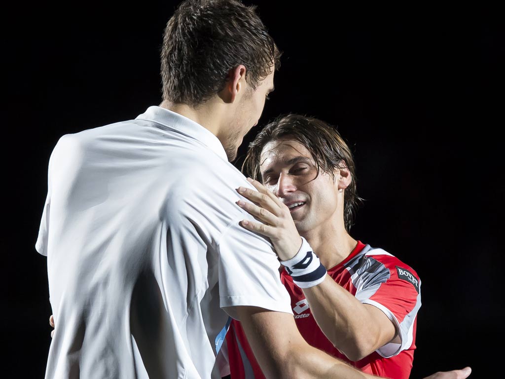 David Ferrer (R) shakes hands with Jerzy Janowicz at the Paris Masters