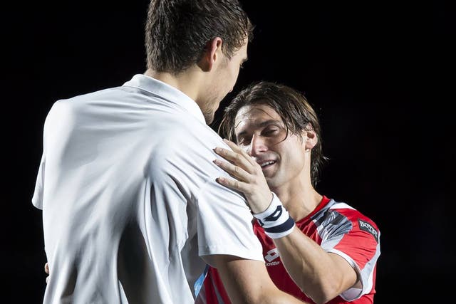 David Ferrer (R) shakes hands with Jerzy Janowicz at the Paris Masters