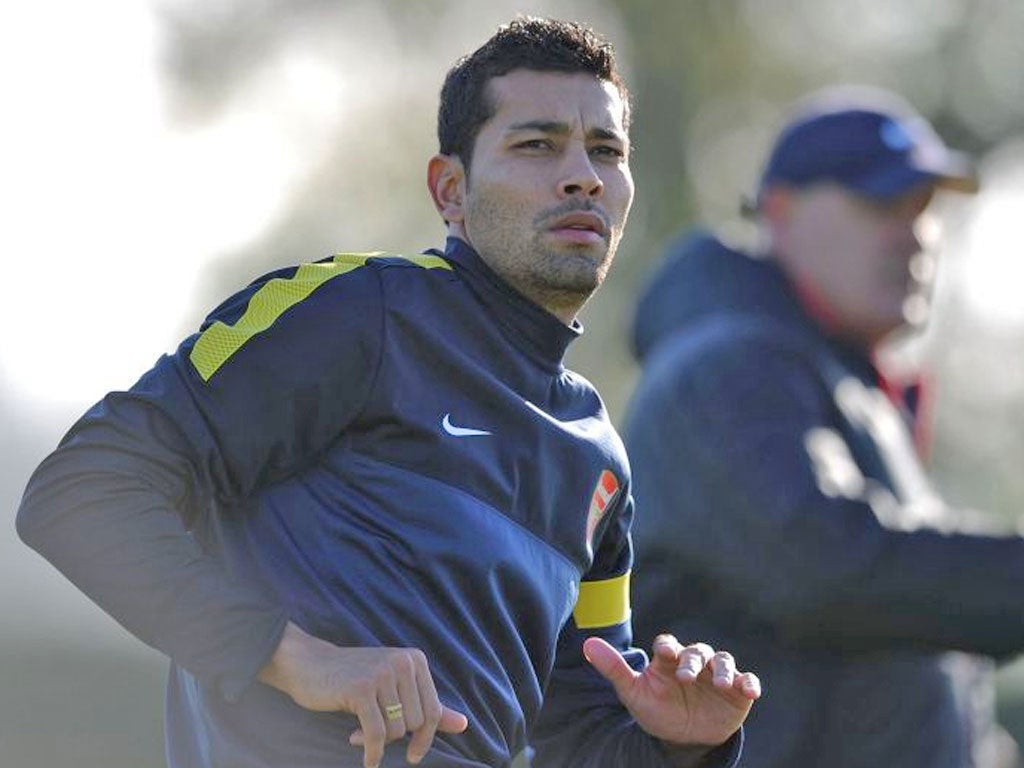 Andre Santos takes part in training at London Colney
