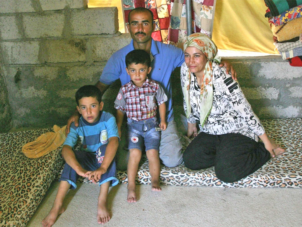 A Syrian-Kurdish refugee family in the Domiz refugee camp, in northern Iraq