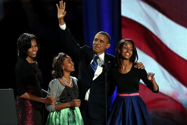 <p>Michelle and Barack Obama with their daughters Sasha and Malia in Chicago.</p>