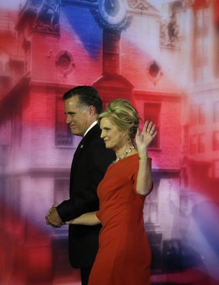 Republican presidential candidate Mitt Romney and his wife Ann walk off the stage after Romney conceded the race during his election night rally